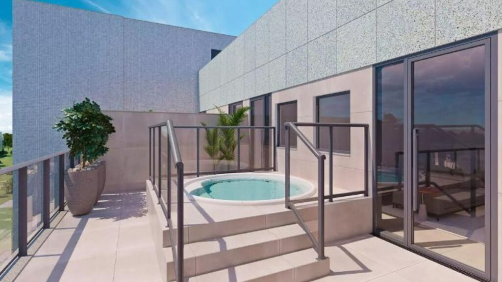 Deck com hidromassagem circular e escada de acesso em área externa privativa com guarda-corpo de vidro em um Apartamento 3 Quartos Noroeste - Residencial Yard.