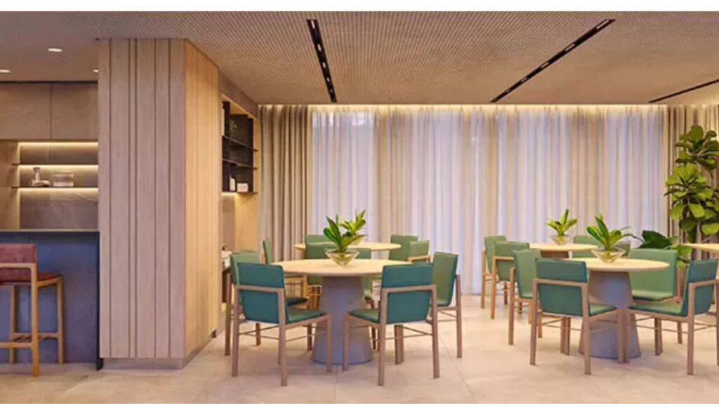 Salão de festas e recepções com mobiliário de alto padrão, cadeiras com estofado verde esmeralda, bancada gourmet e iluminação linear em um Apartamento 3 Quartos Noroeste - Residencial Yard.