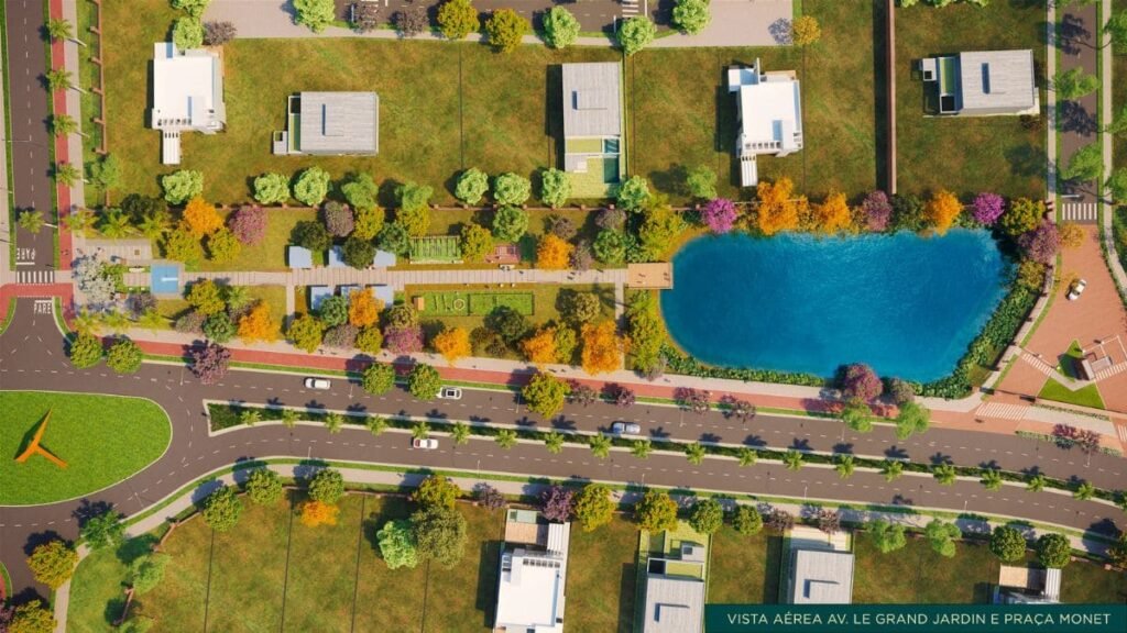 Imagem aérea de renderização urbanística mostrando a Avenida Le Grand Jardin e a Praça Monet, com um grande lago azul à direita, áreas verdes arborizadas com ipês coloridos, ciclovia e residências modernas ao redor, representando a infraestrutura de um Lote Jardim Botânico.